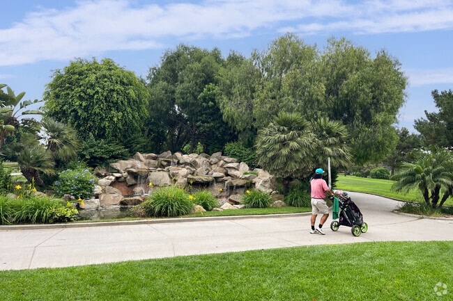 Take your clubs to Skylinks, stroll past the water feature and head to the links.
