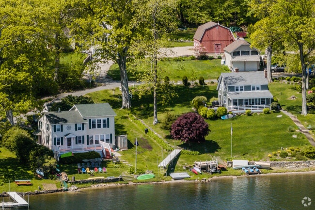 Homes surround Wangumbaug Lake aka Coventry Lake, offering small private beaches.