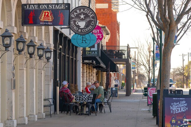 Shops and restaruants line the streets of the Historic Square in Granbury, TX.