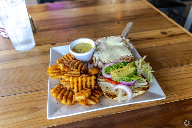 Locals enjoy the Turkey Melt and waffle fries at Cafe Gecko in The Reservation.