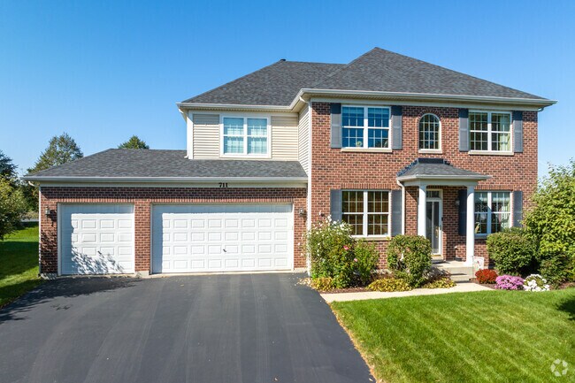 Freedom Park’s brick multistory homes include large garages and extended driveways, ideal for families and multi-car households.