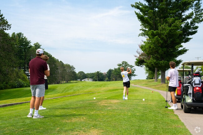 Golfers tee off at Bloomer Memorial Golf Course, public since 1930.