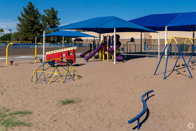 Kyrene de los Niños Elementary School students enjoy playing on the playground during recess.
