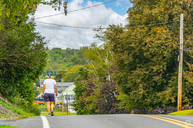 Even though there are no sidewalks, you'll see neighbors walking the streets of Grimesville.