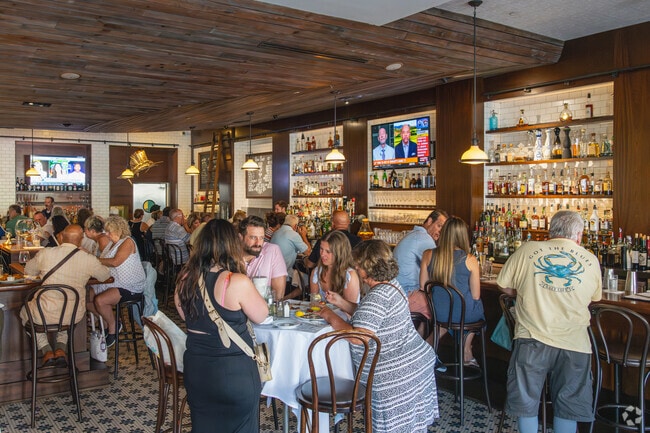 Dock's Oyster House features a lively happy hour and nightly piano music in Duck Town.