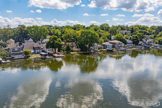 Pewaukee Village lakefront homes are tightly packed together with shallow backyards.