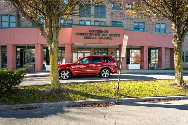 A parent dropping off a child at Delsesto Middle School's main entrance located in Providence.