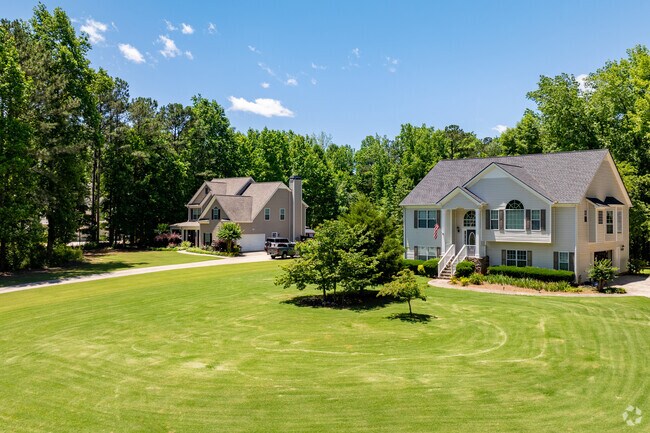 Fairplay is where estate homes sit tucked into wooded acres with long private drives.