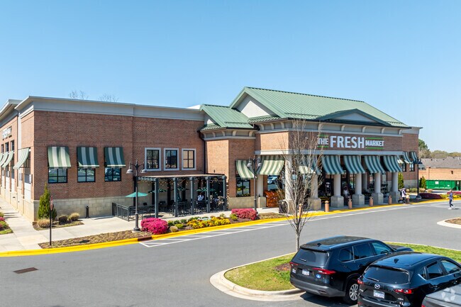 Locals do their grocery shopping at The Fresh Market in Providence park.