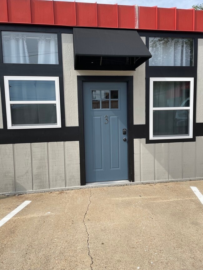 Keypad entry with awning entrance.