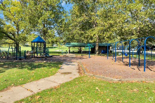 Families gather at the Kiwanis Park playground, where fun and adventure await young ones.