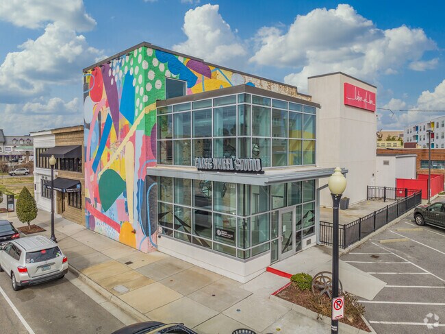 This colorful mural in Ghent Square was painted directly in front of the Glass Wheel Studio.