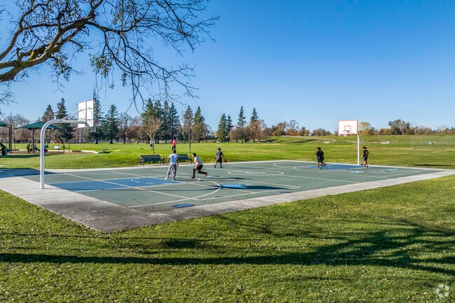 Challenge your friends to a game of basketball at Alyce Norman Park.
