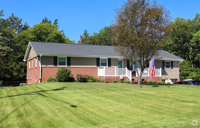 You can find brick ranch homes in New Sherwood Forest with large front yards.