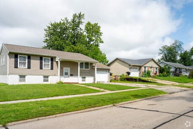 Charming row of homes, each with its own unique character and story in Cherry Hill Park.
