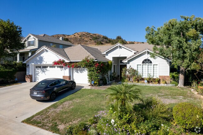 This West Hills residence features classic architecture and a well-kept front yard.