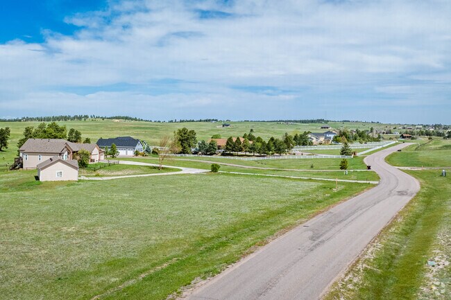 Ponderosa Park's winding streets give way to ranch-style homes with garages and fencing.