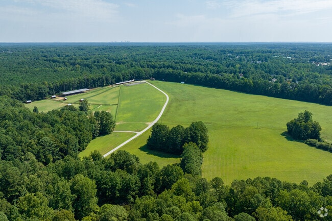 Farms in Middle Creek are spread among the trees and houses.