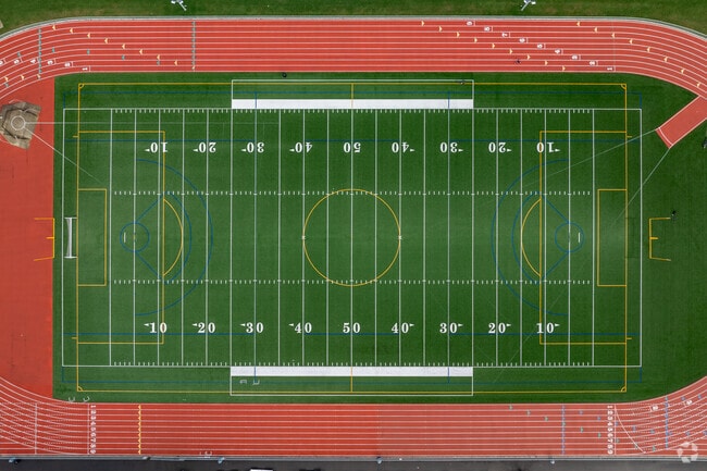 Lined for soccer and football, the field at Evergreen High School in Vancouver, WA, is busy.