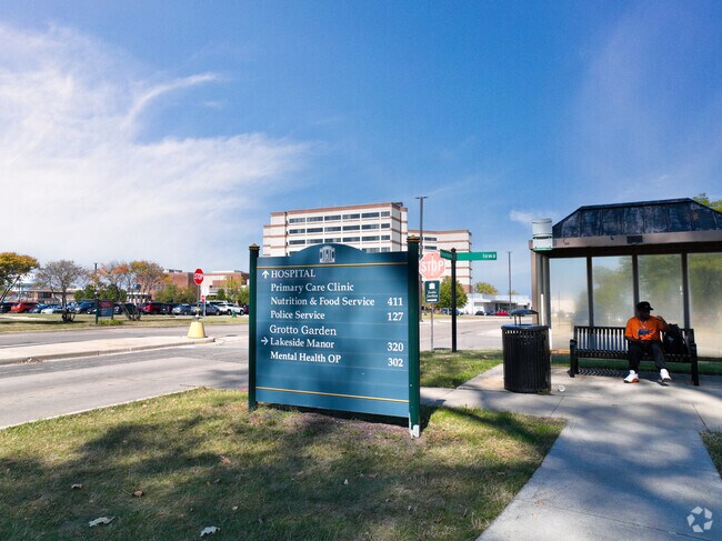 Many pedestrians will wait for the bus on Iowa Street.
