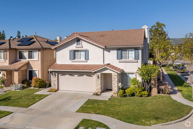The rock trim on this two-story home in Lower Peters Canyon has a large yard with space.