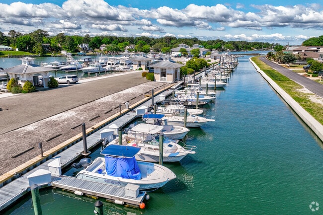 Center console fishing boats line the marina near the Broad Bay Island neighborhood.
