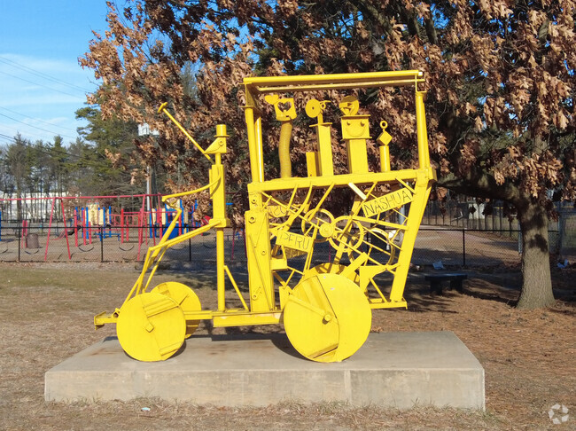 A unique art sculpture sits by the playground at Ledge Street Elementary School.