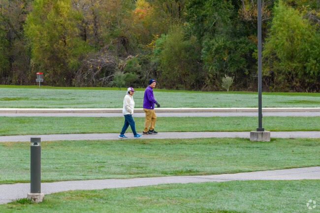 A couple takes a morning walk in Arceneaux Park, located in Broussard, Louisiana.