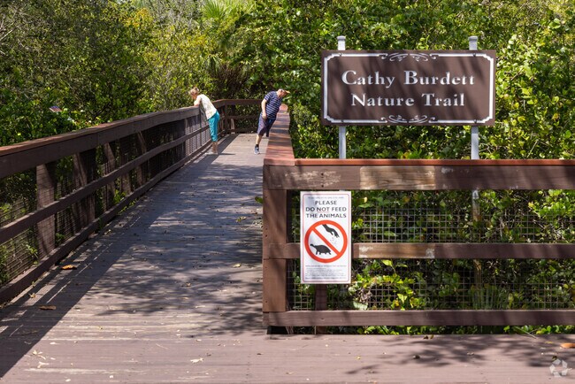 Boca Grove residents take long walks in and around the Cathy Burdett Trail.