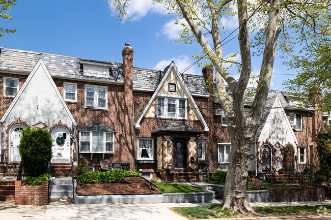 Attached brick Tudor houses are very common in Middle Village, Queens.