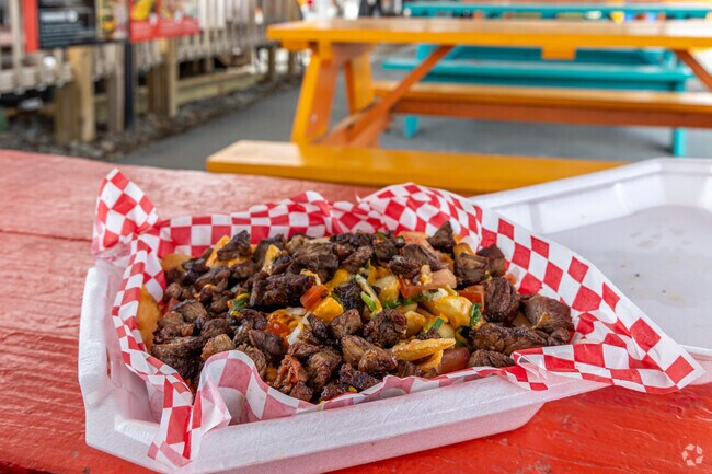 Try the carne asada fries from the La Fogata food truck in the Centerton Food Truck Park.