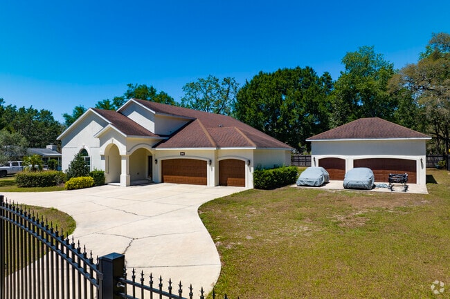 A large, custom home sits behind the gates in the Bloomingdale neighborhood.