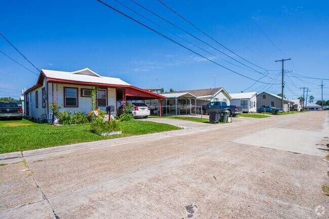 Most Acadian homes have a covered carport and a driveway accommodating one to two cars.