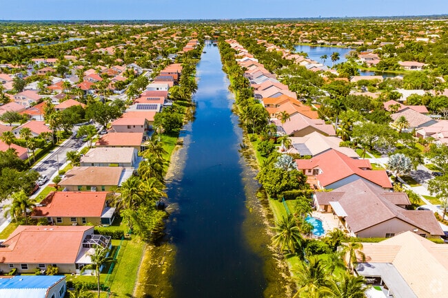 Embrace the classic beauty and timeless appeal of homes with stucco exteriors and distinctive clay pipe-looking roofs in Westfork, Florida.