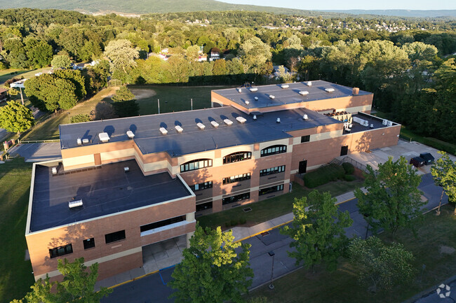 Situated in a nice arboreal location, the Mowrie A. Ebner Elementary School in Altoona is nice.