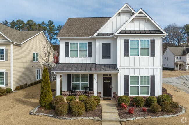 New traditional style homes tower the streets on West Highlands.