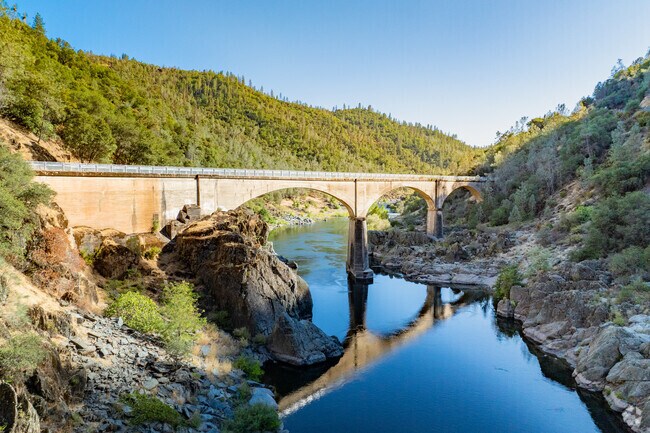 Mountain Quarries Railroad Bridge near Auburn Lake Trails spans the river.