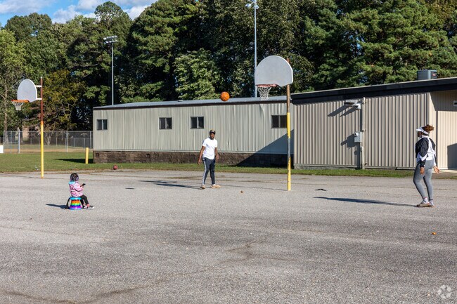 The whole family likes to play at the courts at B. C. Charles Elementary School.
