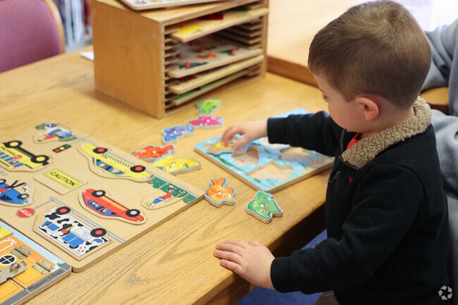 Children in North Reading enjoy the games in the Children's room at the North Reading Library.