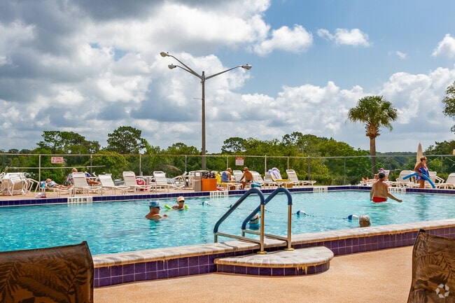 Residents enjoy catching up with neighbors at the pool in Brookridge.