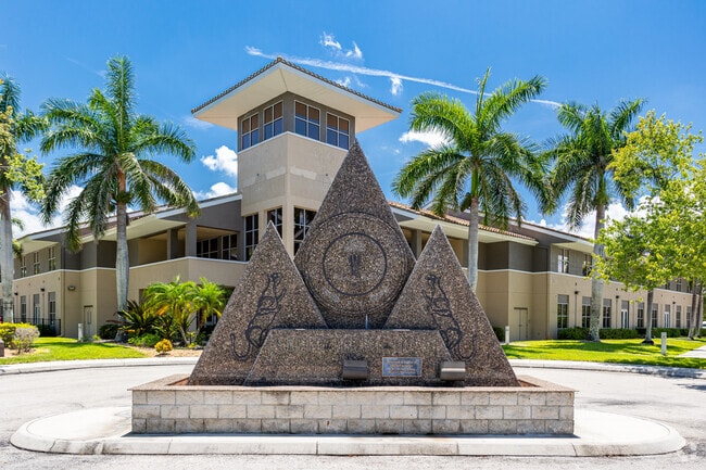 Naples Christian Academy features a large decorative statue at the main entrance.