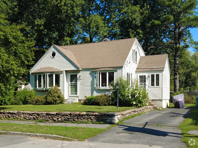 This single-family home has a well-manicured front lawn in Nasons Corner.