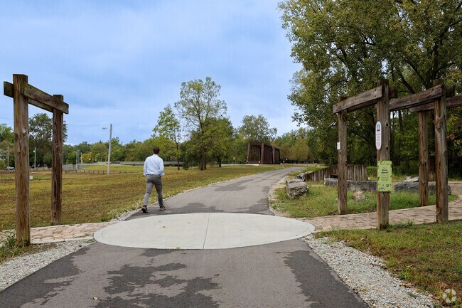 Walkers cut right through the Greenway Pocket Park along the Cardinal Greenway.