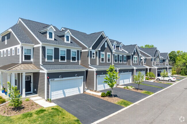 Townhomes at the Naper Commons subdivision in the Danada neighborhood offer 2-car garages.
