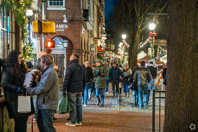 Holiday lights and market stalls line Gay Street during West Chester’s Christkindlmarkt.