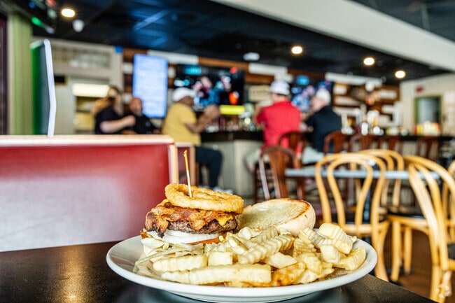 Enjoy the bacon cheeseburger at Mudville Grill as it is the most popular item on the menu.