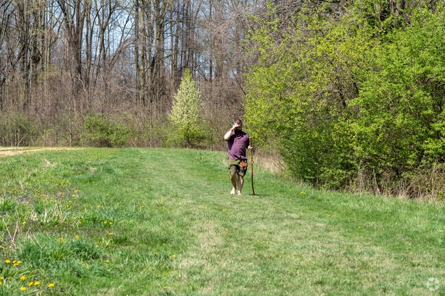 A hiker enjoys the trails at Sand Run Metro Park's Hawkins Area in Wallhaven.