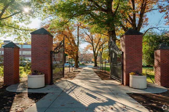 The gates of Worcester State University welcome students.