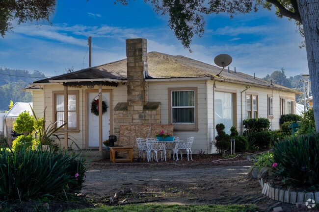 This ranch house whispers serenity in the embrace of nature.
