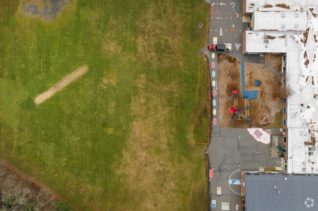 John F. Kennedy Memorial School has an outdoor play area for students.